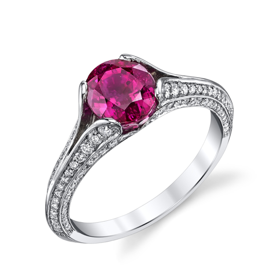 Darren McClung original platinum ring set with a 2 carat Oval Burma Ruby center and colorless ideal cut pave diamonds graduate in size to accentuate the contours