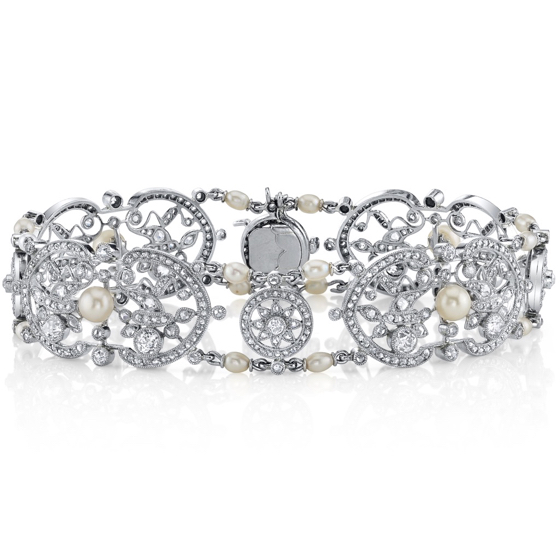 Exquisite French Belle Epoque, floral motif platinum bracelet set with natural pearls, rose and old mine cut diamonds, circa 1910